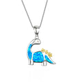 Dinosaur-shaped pendant with blue opal and gold accents on a white background