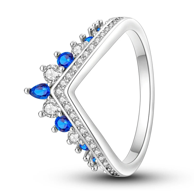 Silver ring with blue gemstones on a white background