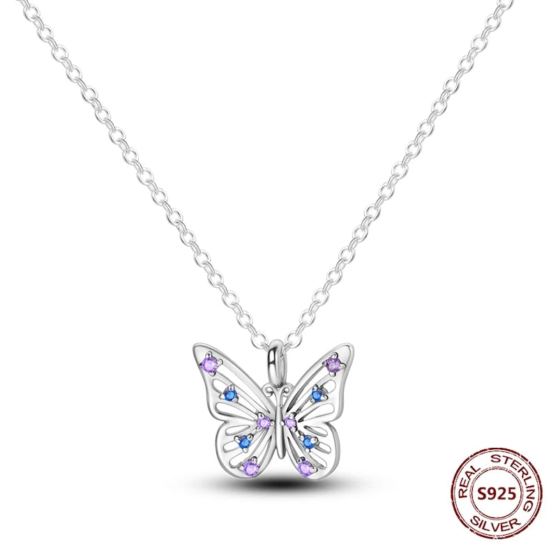Silver butterfly necklace with gemstones on a white background
