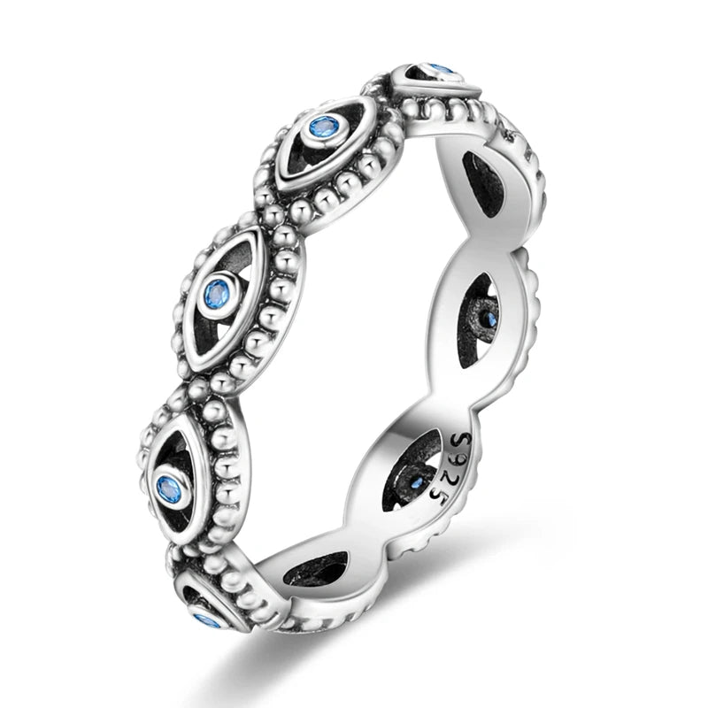 Silver ring with blue gemstones on a white background